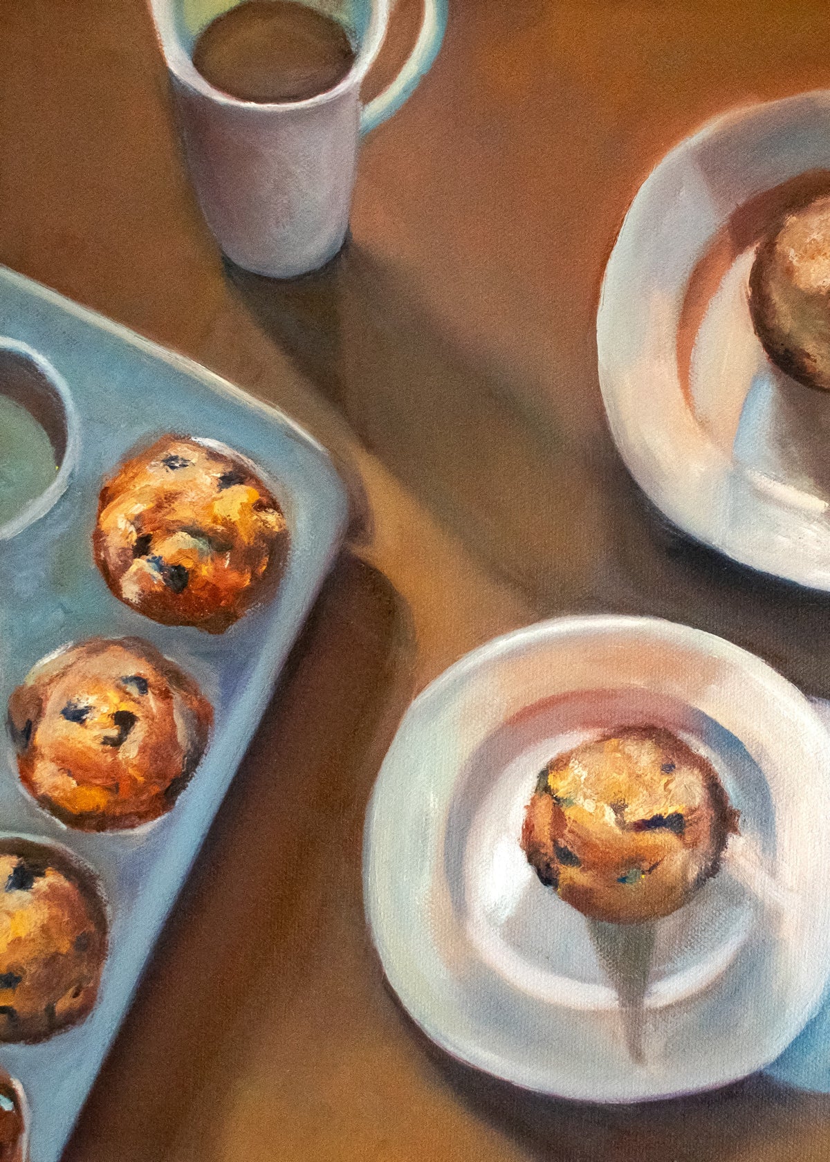 Morning Muffins — blueberry muffins in a pale blue tin and on white plates, beside a mug of coffee on a warm wooden table