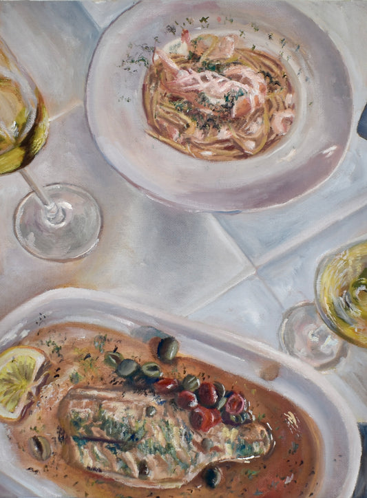 Dinner for Two — a restaurant table from above, pasta with shrimp and branzino with olives and capers, two glasses of white wine on a white cloth