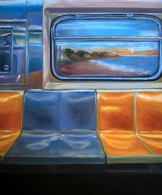 Where I want to be — a NYC subway car with fluorescent lights and bright blue and orange seats, its windows opening onto the California coast